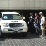 Members of the United Nations chemical weapons investigation team wait for their vehicles with other members of their team before leaving a hotel in Damascus on Wednesday.