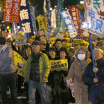 Protesters shout slogans during a march against the government's planned secrecy law in Tokyo