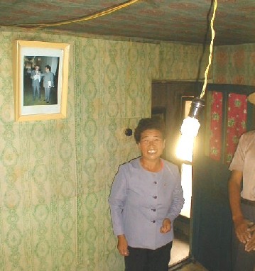 Efficient, compact fluorescent lamp lights a home in Unhari Village.  