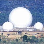 Figure 27. Radomes at Pine Gap, c 1991. (Antennas 68-B, 80-B, 71-A, 84-A HF LPA, 73-A, 68-A, 77-A, collimation tower behind 85-A, 85-A, 86-A without radome in front of 85-A, and 90-A). Source: Erwin Chlanda, 'Spy base and Kindergarten: Are they above the law?’ Alice Springs News Online, 12 December 2012, at http://www.alicespringsnews.com.au/2012/12/12/spy-base-and-kindergarten-are-they-above-the-law/.